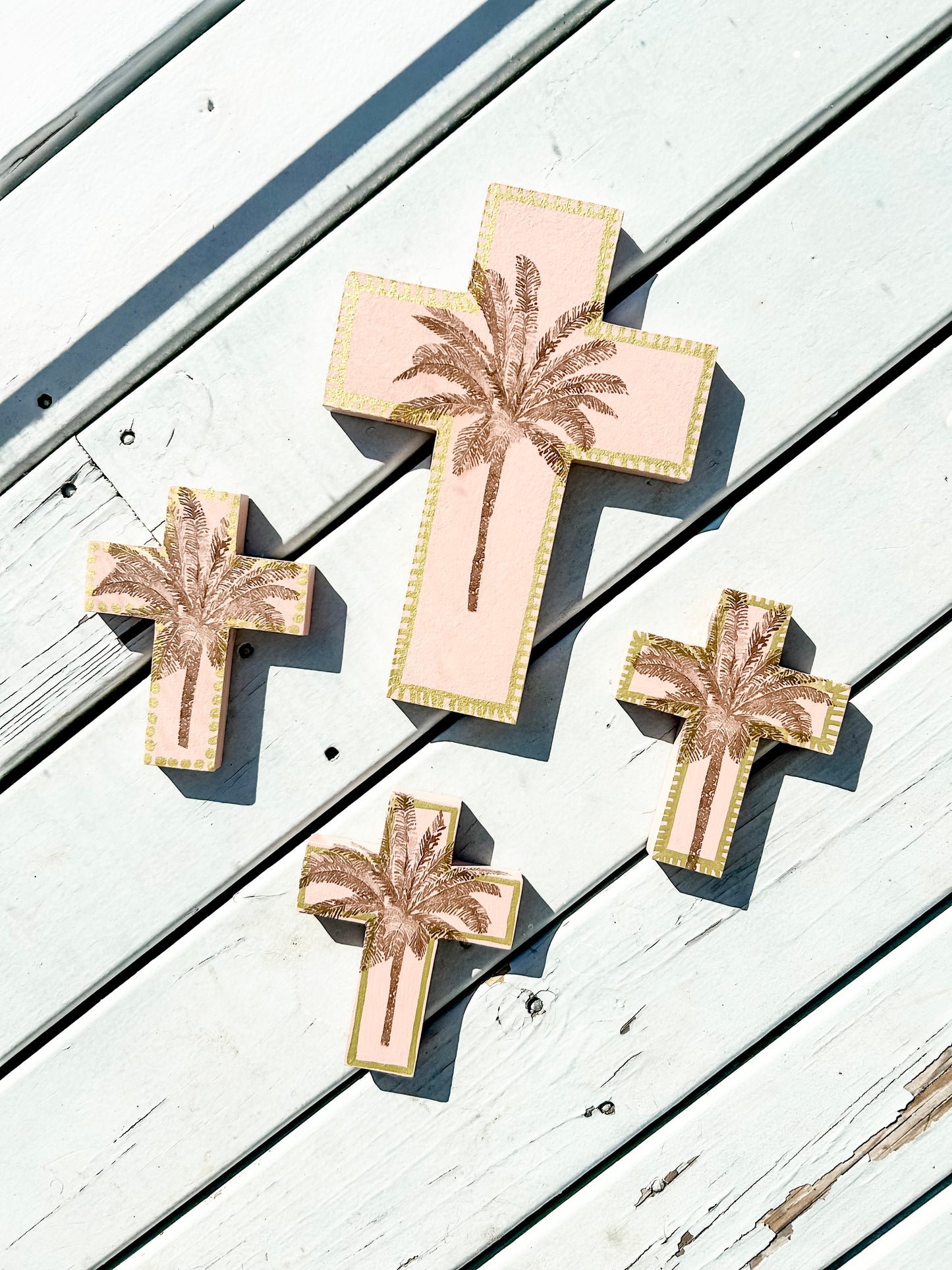 Decor for your holiday home, vacation rental, Airbnb property, decorate tropical style. For lovers of peach and peachy pink. Palm tree decor. Palm tree wall cross. Neutral browns and pinks. Decor for a little girl's room.