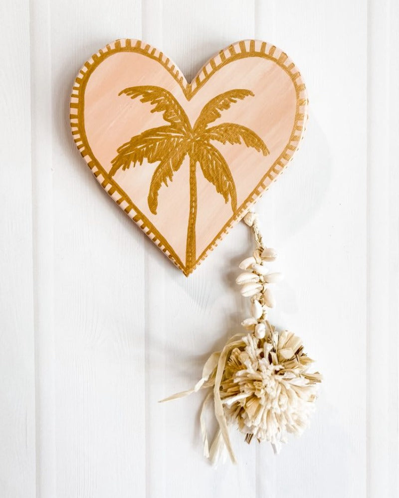 For lovers of neutrals and lovers of peach, desert tones, modern boho bohemian vibe decor palm trees beautiful details raffia pompom and tassel decoration. Heart wall hanging. heart wall tile. 
Decor for your holiday home, beach house, dream home, Airbnb property, Coastal Home, beach house, vacation property.