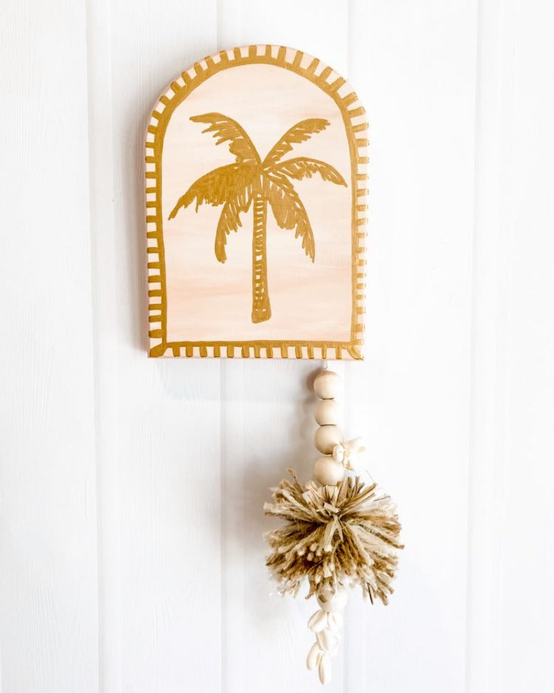 For lovers of peach, desert tones, modern boho bohemian vibe decor palm trees bronze details raffia pompom and tassel decoration