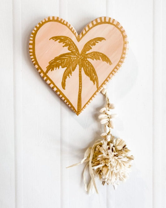 For lovers of neutrals and lovers of peach, desert tones, modern boho bohemian vibe decor palm trees beautiful details raffia pompom and tassel decoration. Heart wall hanging. heart wall tile. 
Decor for your holiday home, beach house, dream home, Airbnb property, Coastal Home, beach house, vacation property.