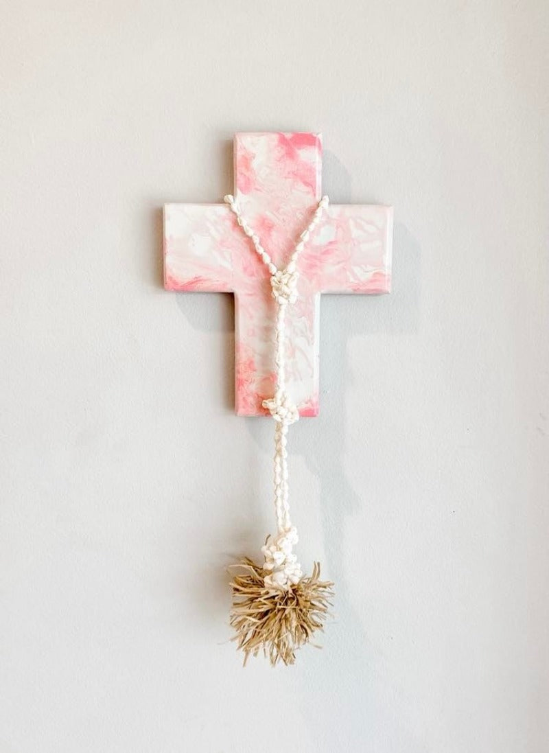 Pink and white marble effect, beachy boho holiday home decor with shells and raffia