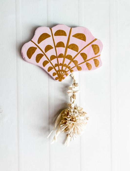 For lovers of peach and pink, desert tones, modern boho bohemian vibe decor palm trees bronze details raffia pompom and tassel decoration For lovers of neutrals, desert tones, modern boho bohemian vibe decor palm trees beautiful details raffia pompom and tassel decoration. Sea shell wall hanging. seashell wall tile. 
Decor for your holiday home, beach house, dream home, Airbnb property, Coastal Home, beach house, vacation property.